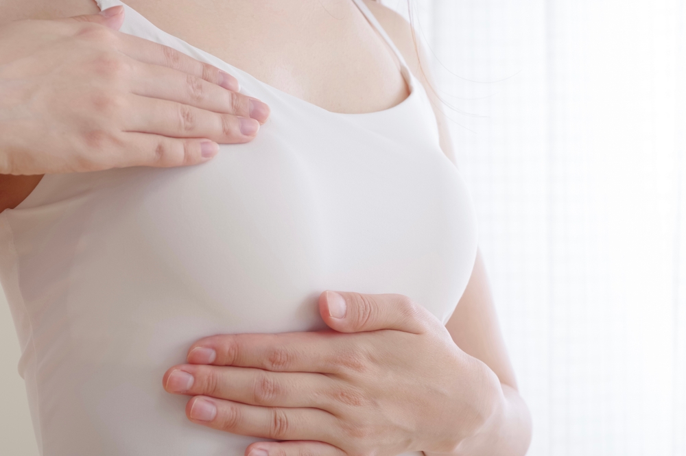 Japanese,Woman,Doing,A,Self-check,Of,Breast,Cancer